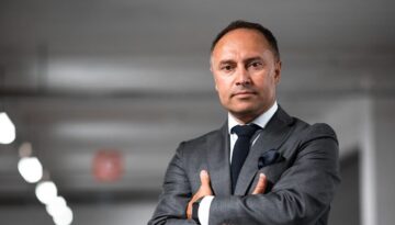 man wearing gray suit jacket and dress pants